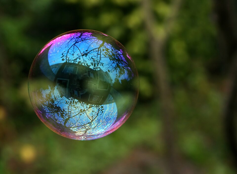 Giant soap bubble showing thin-film interference colours from surface tension