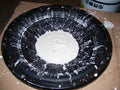 Oobleck non-Newtonian cornstarch fluid forming standing peaks on a speaker