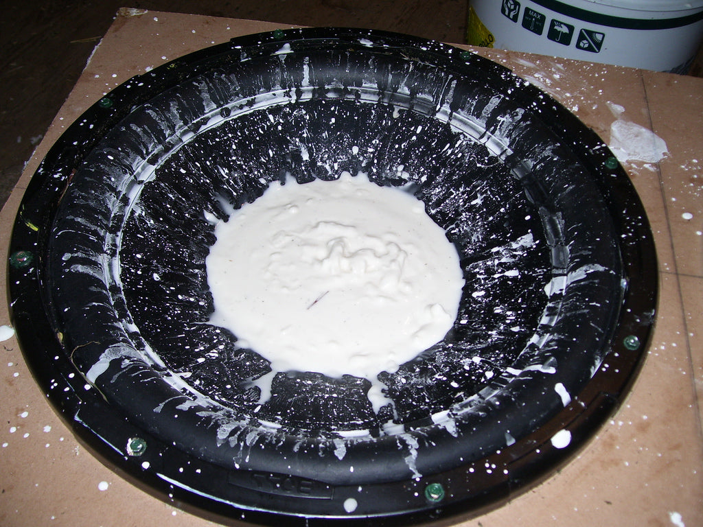 Oobleck non-Newtonian cornstarch fluid forming standing peaks on a speaker