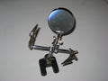 Helping hands station with multiple articulating arms holding components for electronics work