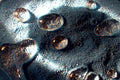 Hydrophobic magic sand repelling water with a trapped air layer