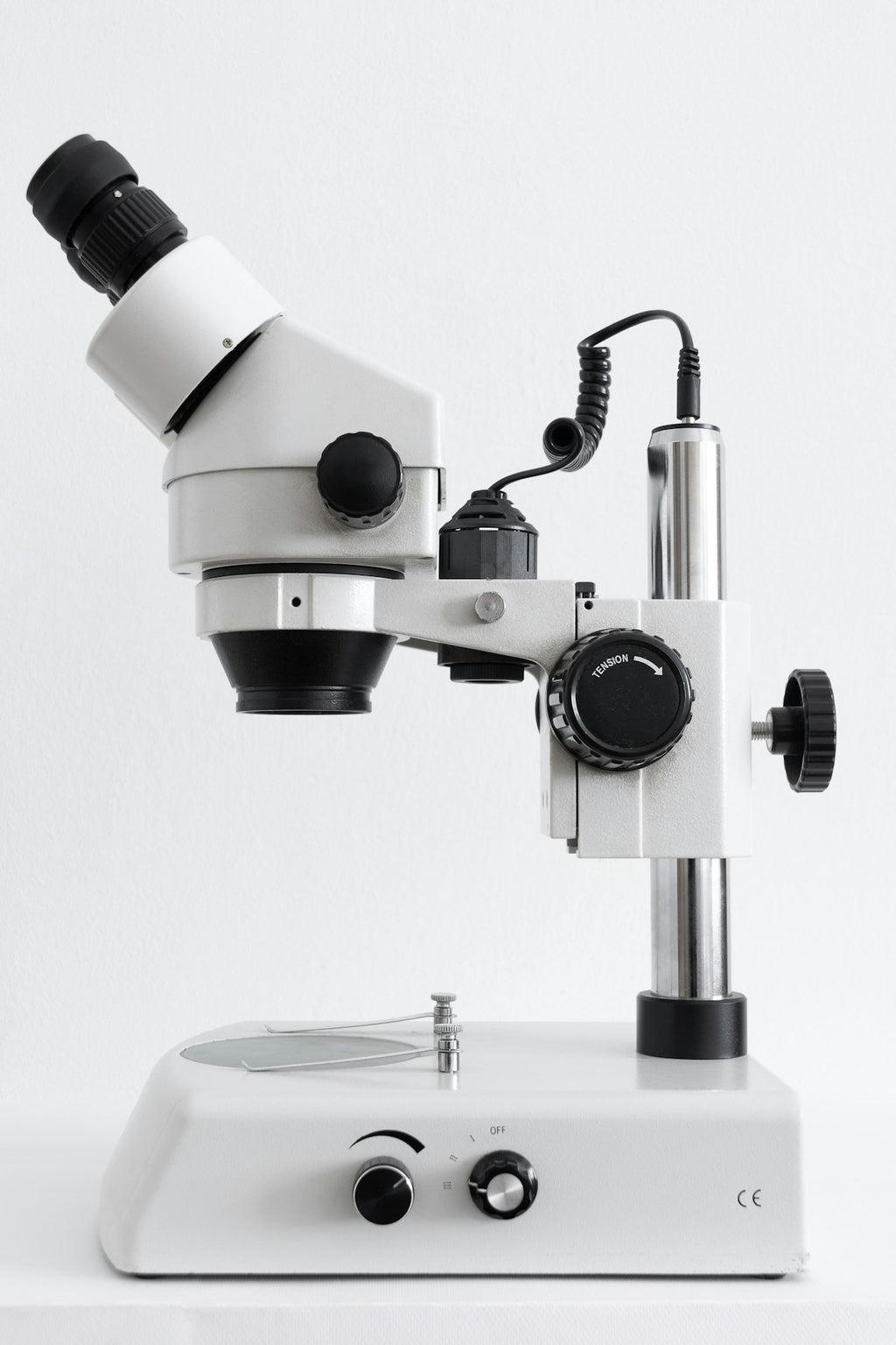 White stereo zoom microscope on clean background
