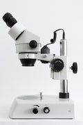 White stereo zoom microscope on clean background