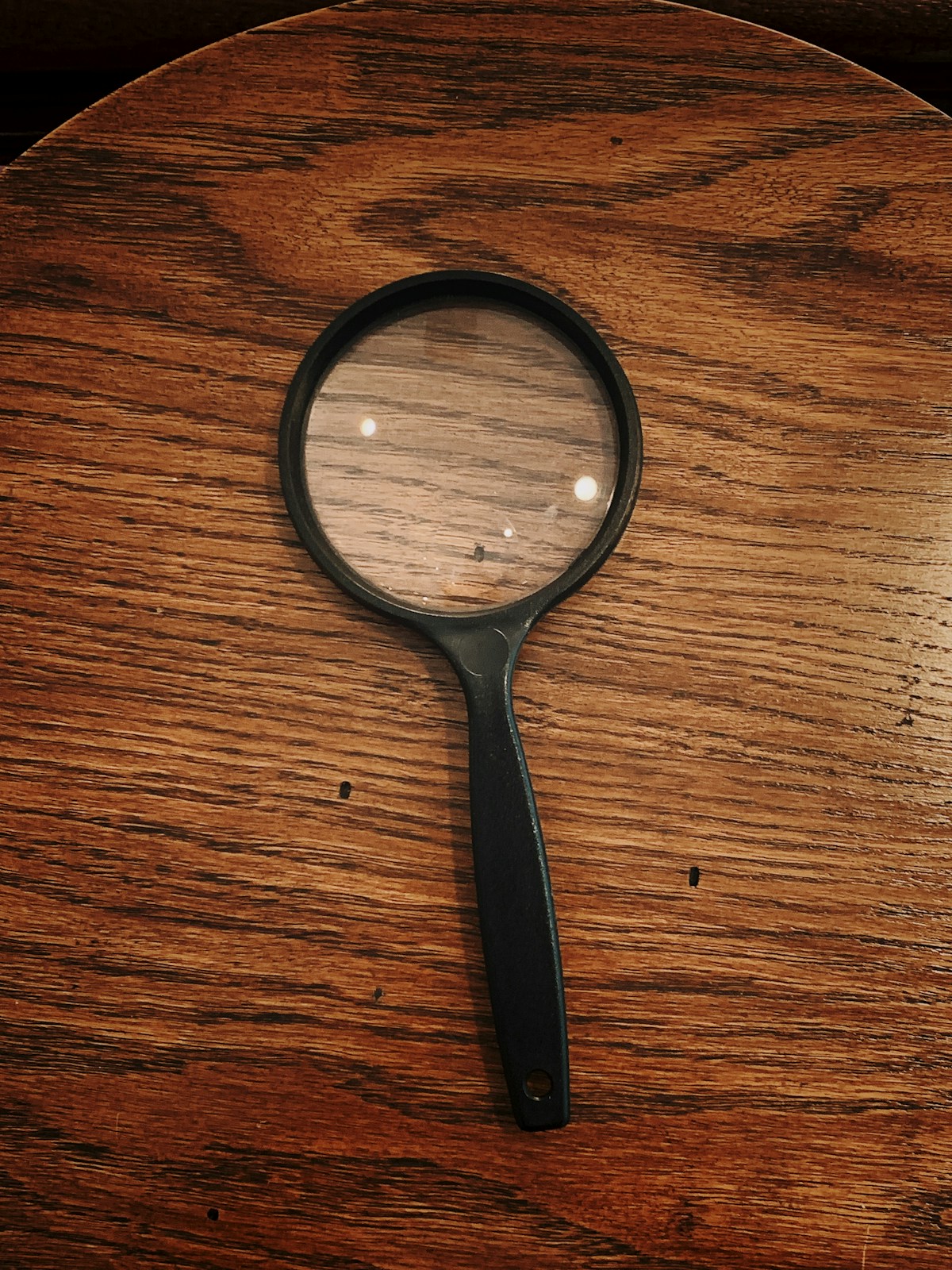 Magnifying glass showing clear optical lens