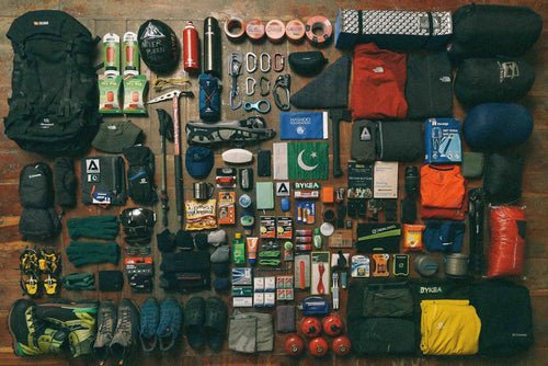 Emergency preparedness and outdoor survival gear laid out