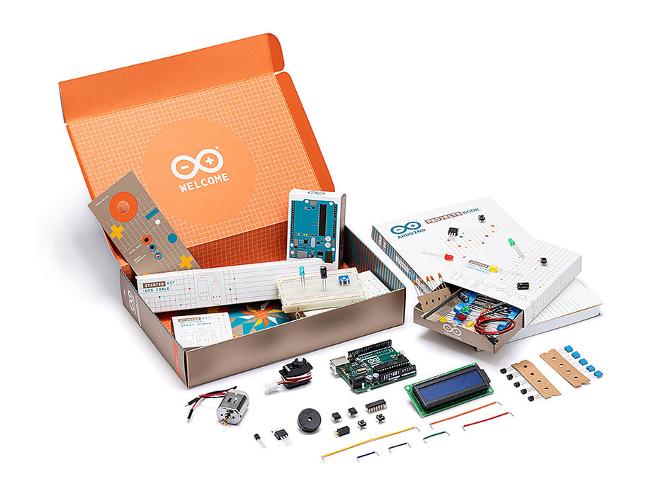 Arduino Starter Kit unboxed with UNO board, breadboard, sensors, and project book